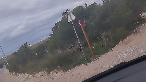 Guy of car spills a lot of milk on a trail near the sea