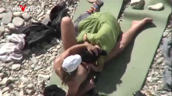 Beach Voyeur. Unashamed nudists having sex on the beach right near others