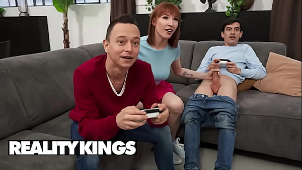 REALITY KINGS – Lilly Mays Sneaks Off with Jordi for a Quiet Fuck While His Friend Keeps Gaming