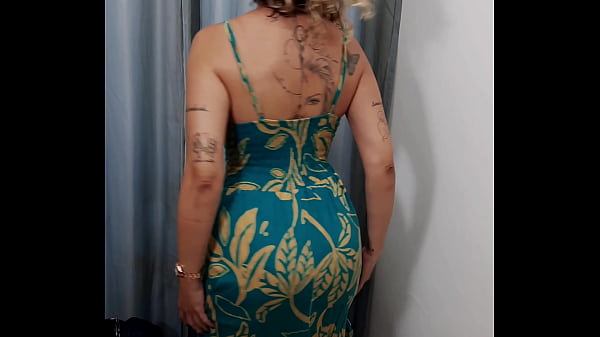 MILF has sex with a salesman in the dressing room.