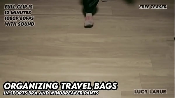 Organizing Travel Bags in Sports Bra and Windbreaker Pants