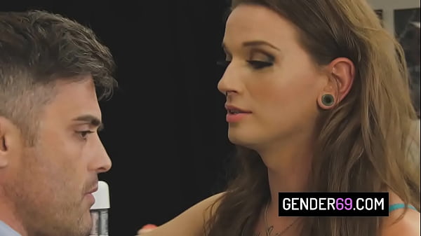 Sexy shemale milf Jena Creed sucks cock via gloryhole and gets banged on the desk