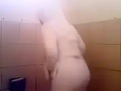 Arab woman goes pee in a public toilet