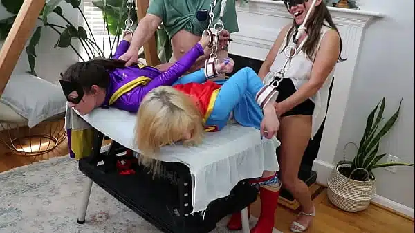 Batgirl and Supergirl forced orgasm