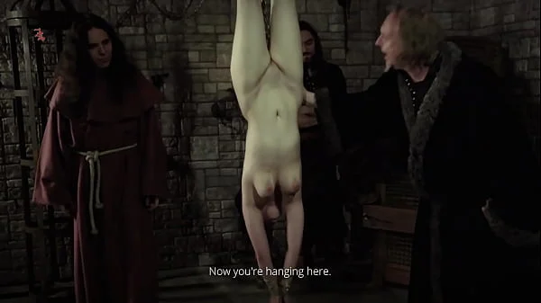 Mooin Witch – The exhausted milkmaid is pulled upside down to the ceiling with weights at her wrists to be tormented and interrogated further and to see milk flowing (preview)