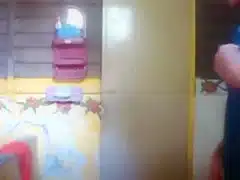 Pakistani woman takes a shower on