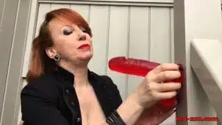 Busty mature Red XXX fucks her dildo on the stairs