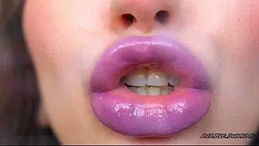 Wet violet glossy kiss close up