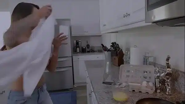 Topless MILF blows and fucks her stepson while she cooks